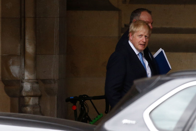 © Reuters. PM hopeful Boris Johnson walks near the Parliament grounds in London