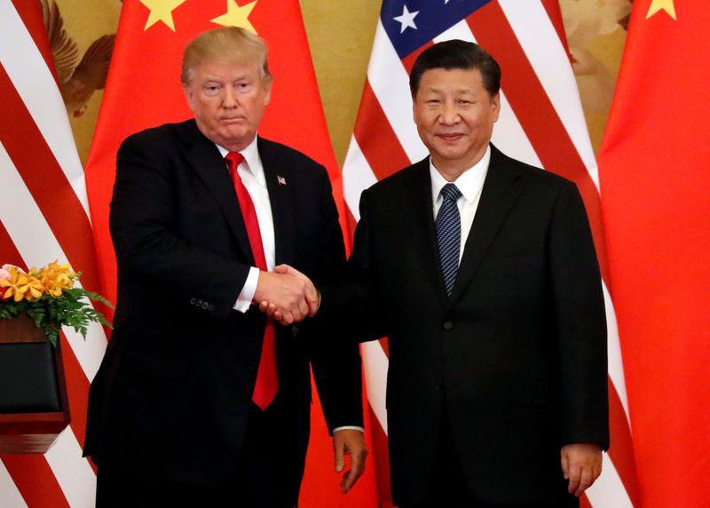 © Reuters. FILE PHOTO: U.S. President Donald Trump and China's President Xi Jinping make joint statements at the Great Hall of the People in Beijing