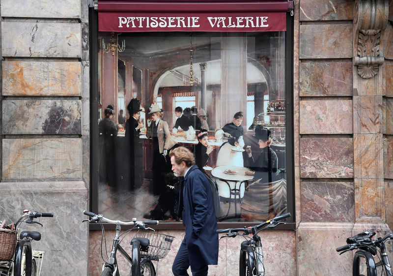 © Reuters. A man walks past a branch of Patisserie Valerie in London