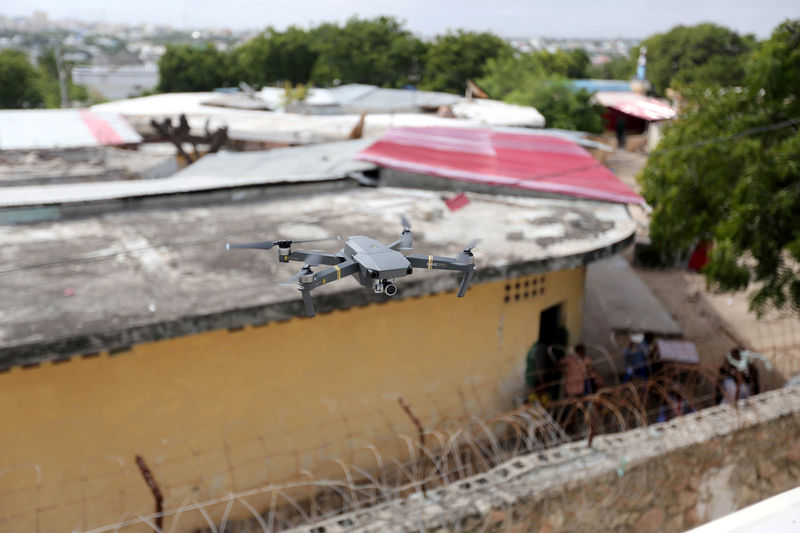 © Reuters. FILE PHOTO: A DJI Mavic Pro drone hovers during a drone training session for Somali police in Mogadishu