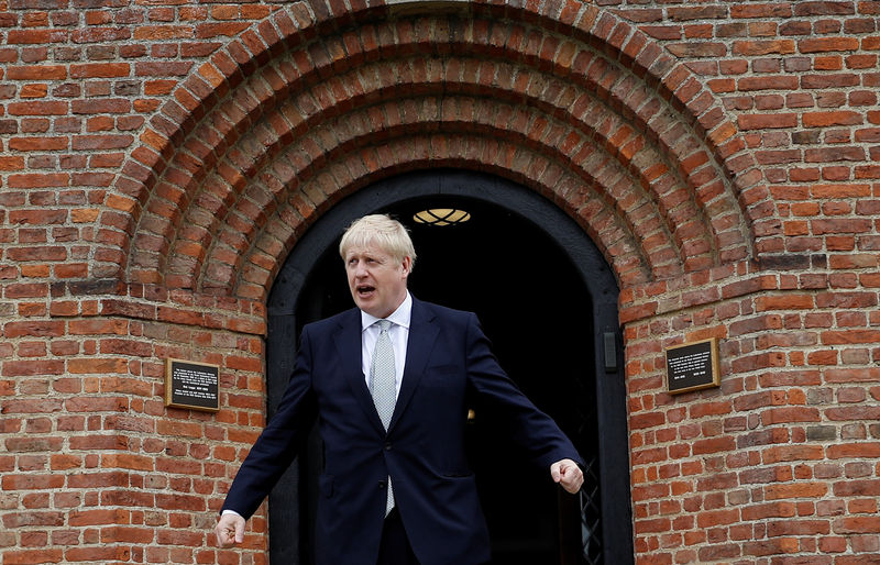 © Reuters. Boris Johnson, a leadership candidate for Britain's Conservative Party, stands outside one of the buildings at Wisley Garden Centre in Surrey