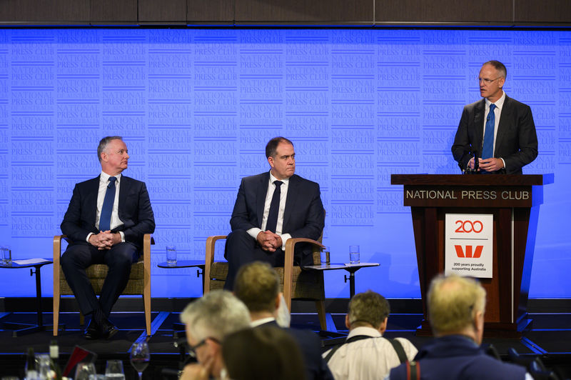 © Reuters. News Corp Executive Chairman Michael Miller speaks while Managing Director ABC David Anderson and Nine Chief Executive Officer Hugh Marks look on during a National Press Club panel discussion in Canberra