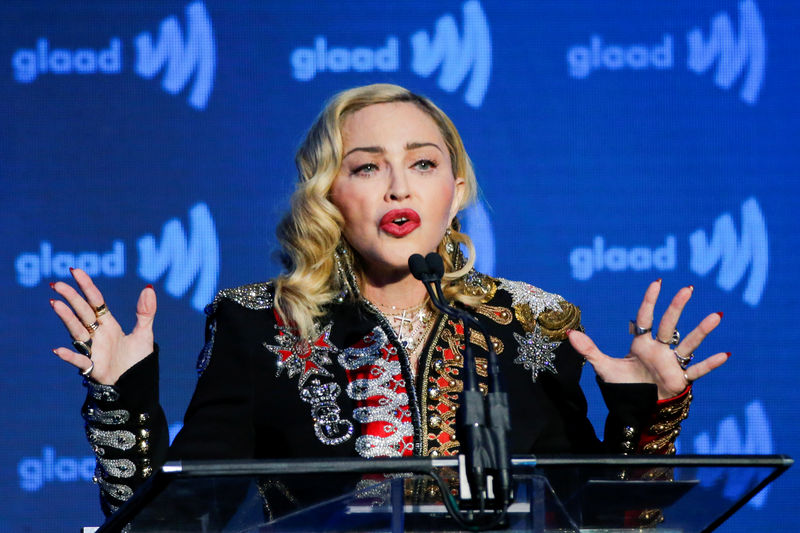 © Reuters. FILE PHOTO: Singer Madonna speaks to guests after receiving the Advocate for Change award during the 30th annual GLAAD awards ceremony in New York City, New York