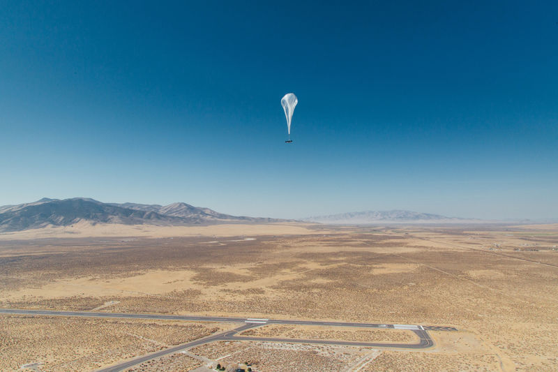 © Reuters. Handout photo of a Loon internet balloon, carrying solar powered mobile networking equipment flies over launch site in Winnemucca, Nevada