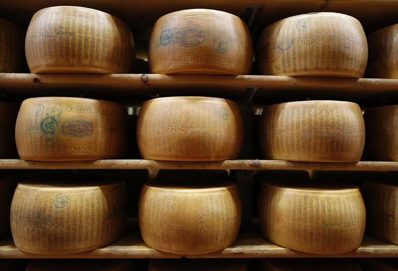 © Reuters. A storage area for Parmesan cheese wheels is pictured at storehouse shelf at 4 Madonne Caseificio dell'Emilia dairy cooperative in Modena