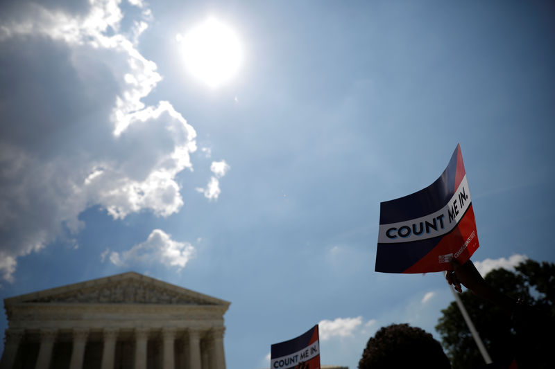 © Reuters. A protester holds sign outside the U.S. Supreme Court in Washington