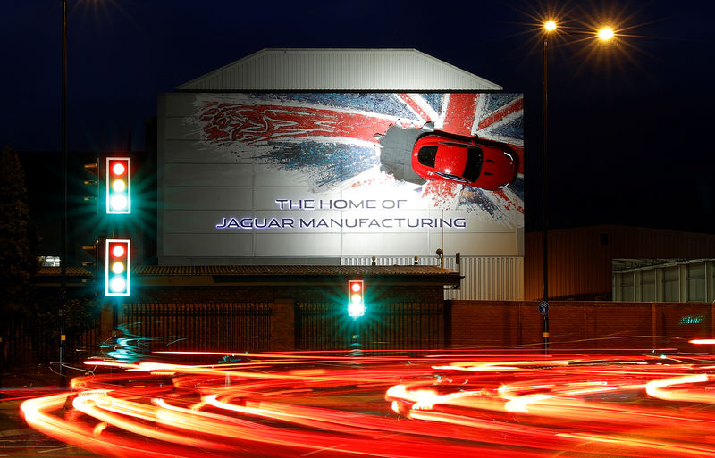 © Reuters. A car hangs on the wall of Jaguar's Castle Bromwich manufacturing facility in Birmingham
