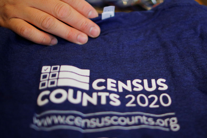 © Reuters. T-shirts are displayed at a community activists and local government leaders event to mark the one-year-out launch of the 2020 Census efforts in Boston