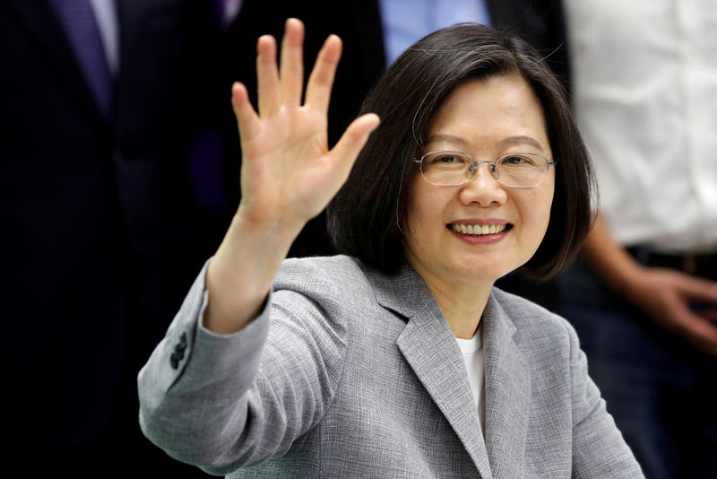 Taiwan president leaves for U.S., warns of threat from 'overseas forces'