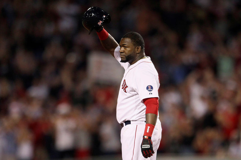 © Reuters. FILE PHOTO: Boston Red Sox's Ortiz stands safe at second base and salutes crowd after hitting 2000th career hit against Detroit Tigers during MLB American League Baseball game in Boston