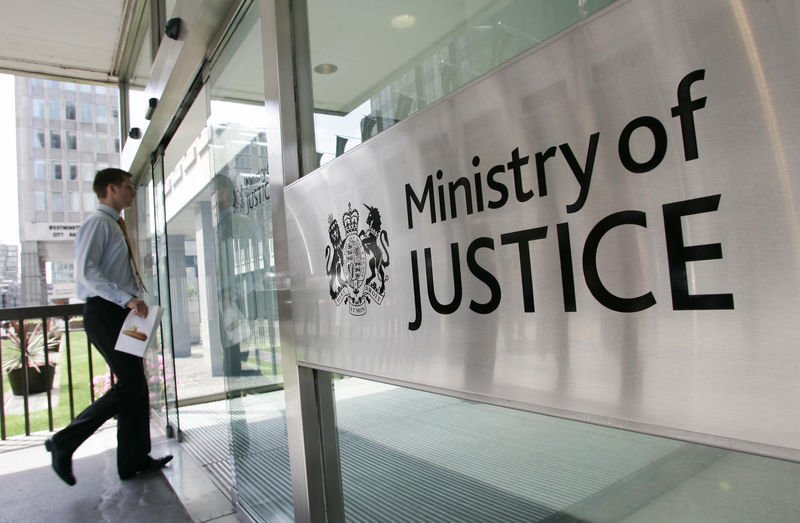 © Reuters. FILE PHOTO:  A man enters The Ministry of Justice in London