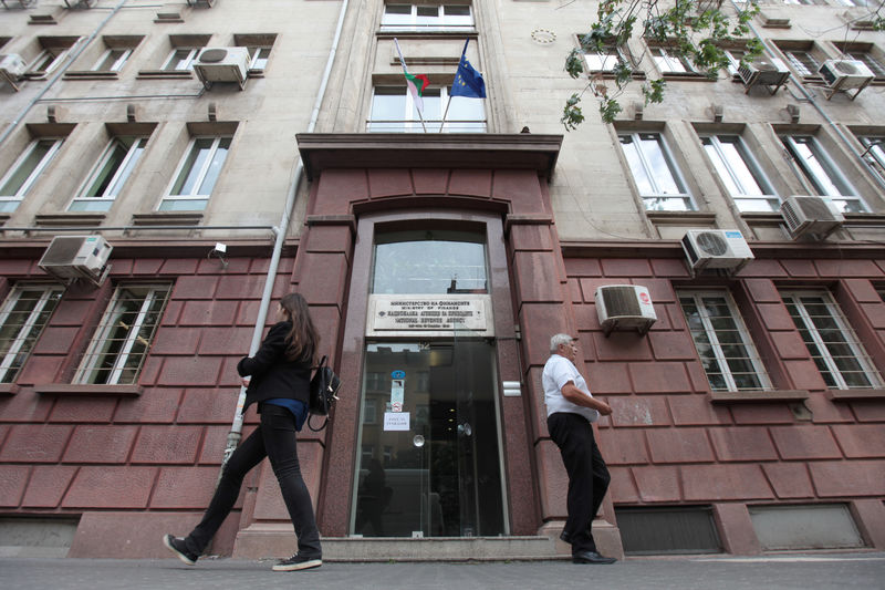 © Reuters. People walk outside Bulgaria's National Revenue Agency building