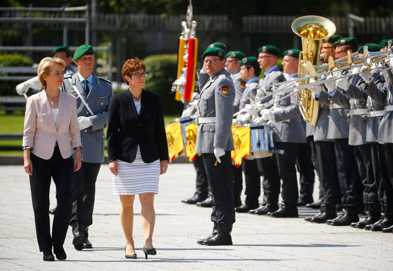 © Reuters. New German defense minister Annegret Kramp-Karrenbauer is welcomed at the Defense Ministry in Berlin