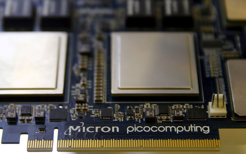 © Reuters. FILE PHOTO: Memory chip parts of U.S. memory chip maker MicronTechnology are pictured at their fair booth at an industrial fair in Frankfurt