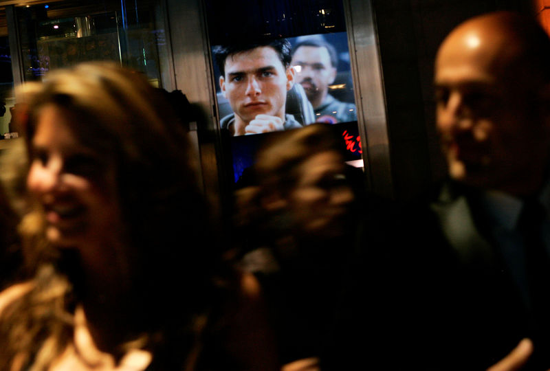 © Reuters. FILE PHOTO: An image of Cruise from the movie "Top Gun" is reflected in a window in New York