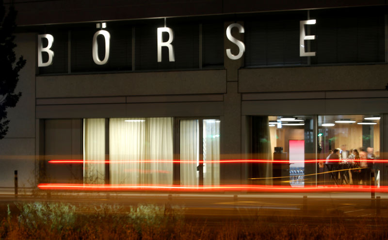 © Reuters. A long exposure shows traffic flowing past the illuminated word "Boerse" (exchange) at the seat of Swiss stock exchange operator SIX Group in Zurich