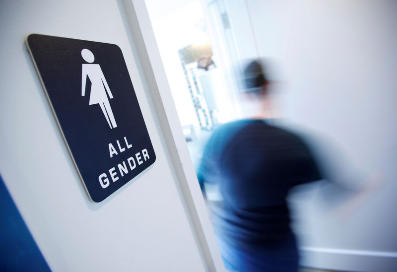 © Reuters. A bathroom sign welcomes both genders in Durham, North Carolina