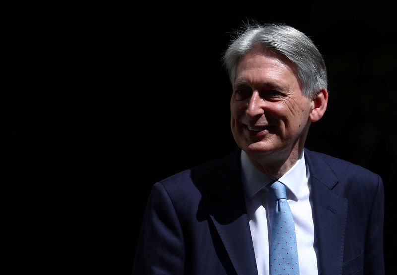 Hammond quits as finance minister before Johnson becomes PM