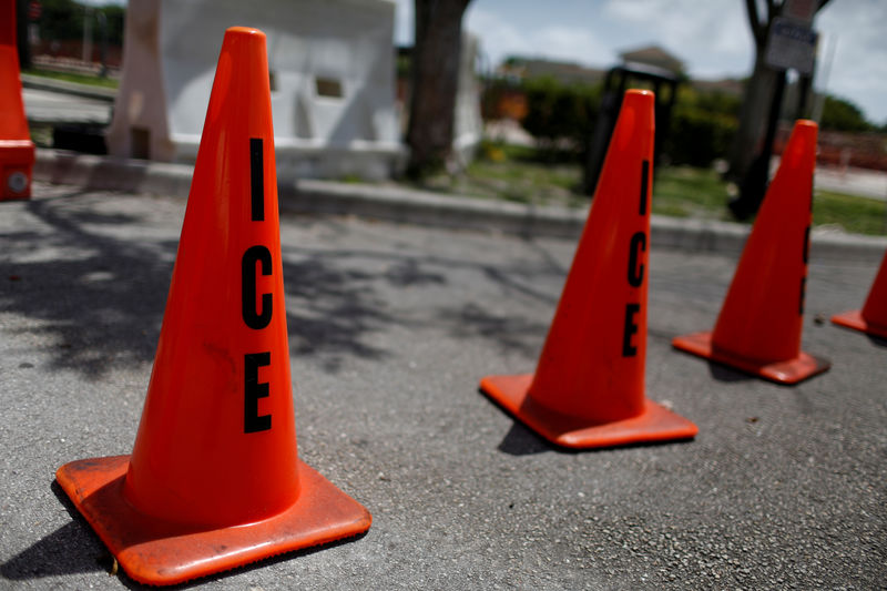 © Reuters. FILE PHOTO: Orange traffic cones with the word "ICE" are seen at ICE facilities as communities brace for a reported wave of ICE deportation raids in Miami