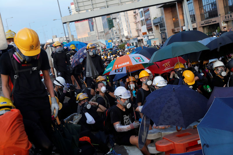 After weekend of violent clashes, Beijing to address Hong Kong unrest