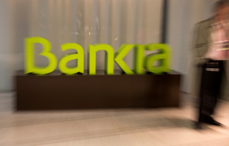 © Reuters. FILE PHOTO: Spain's Bankia logo is seen inside bank's headquarters before a news conference to present their annual results in Madrid