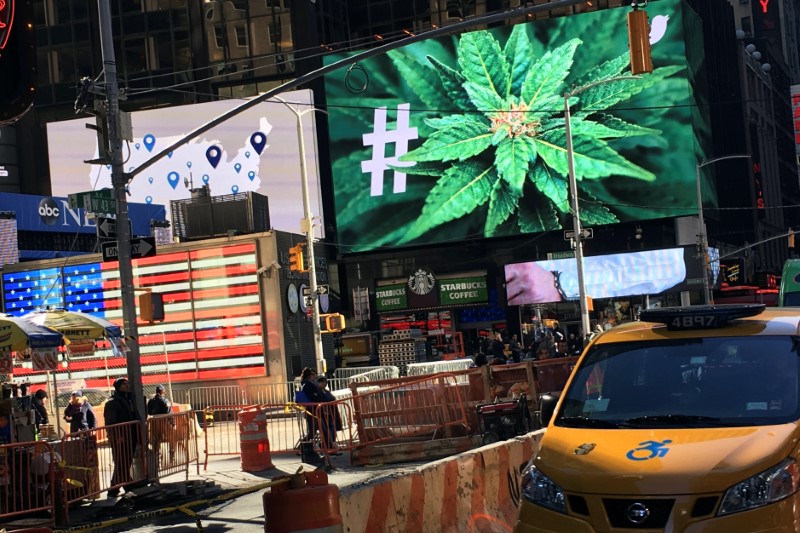 © Reuters. An electronic billboard displays a marijuana hashtag at Times Square in New York