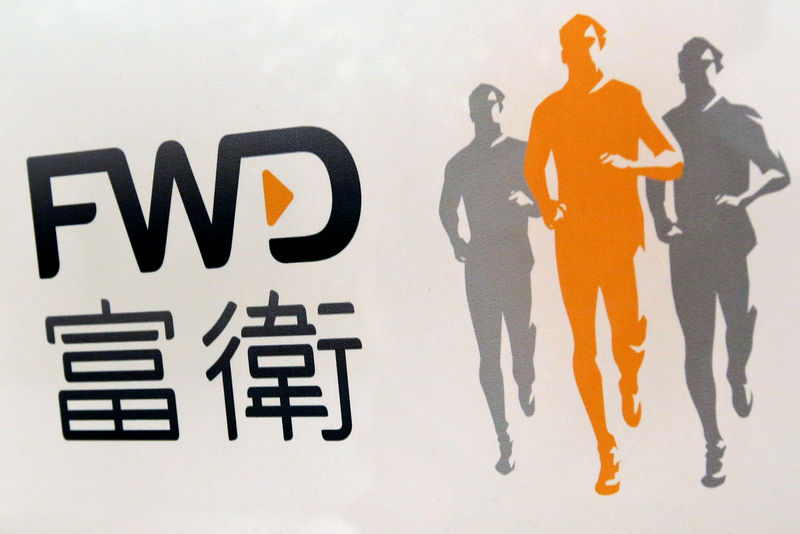 © Reuters. FILE PHOTO: The company logo of FWD is displayed at the lobby of a commercial building in Hong Kong
