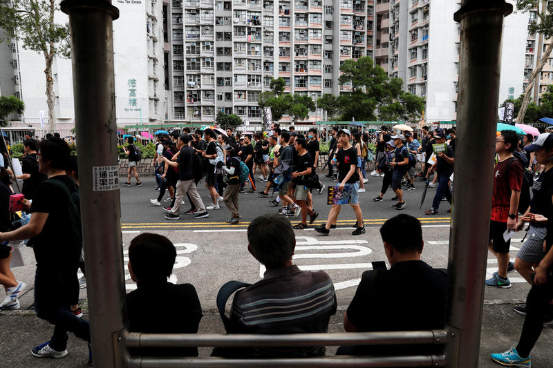 Thousands resume Hong Kong protests, China media warns Beijing won't 'sit idly by'