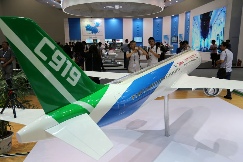 © Reuters. A model of C919 passenger jet by COMAC is displayed at Aviation Expo China 2017 in Beijing