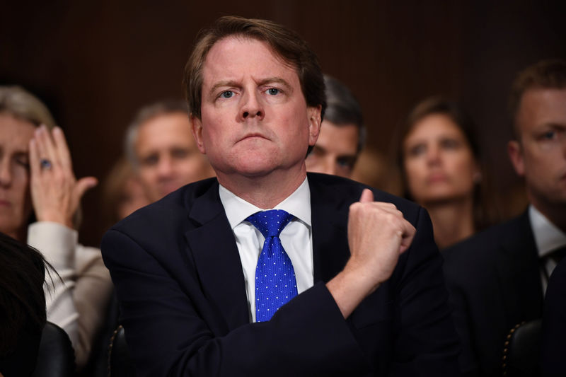© Reuters. White House Counsel Don McGahn listens to Supreme Court nominee Brett Kavanaugh as he testifies before the US Senate Judiciary Committee on Capitol Hill in Washington