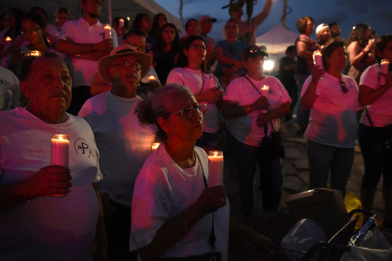 Trump visits mass shooting victims; protesters shout 'Do something!'