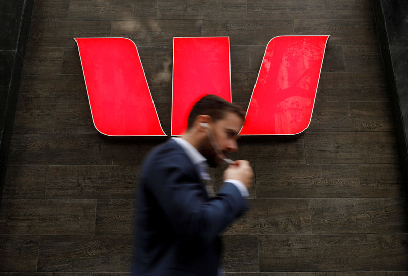 © Reuters. FILE PHOTO: A man walks past a Westpac bank branch in Sydney, Australia