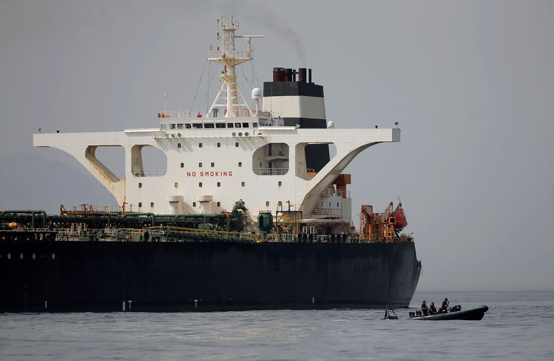 © Reuters. FILE PHOTO: Gibraltar defence police officers guard the Iranian oil tanker Grace 1 as it sits anchored after it was seized earlier this month by British Royal Marines in the Strait of Gibraltar