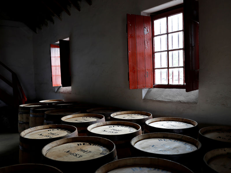 © Reuters. FILE PHOTO: Whisky barrels are stored at the Benromach Distillery in Forres, Scotland