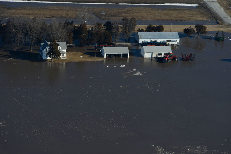 © Reuters. Flooded farm and farm equipment are seen in this aerial photo of the historic flooding conditions in portions of northeast Nebraska