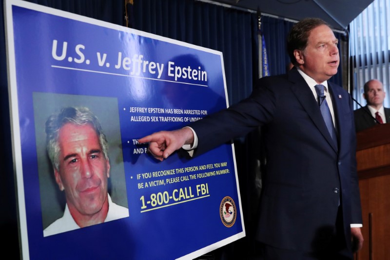 © Reuters. FILE PHOTO: Geoffrey Berman points to a photograph of Jeffrey Epstein in New York