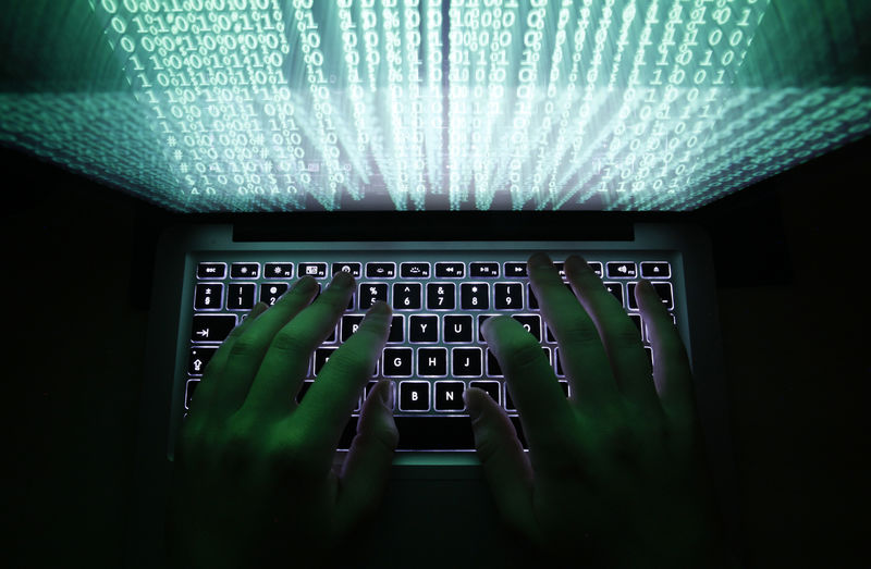 © Reuters. FILE PHOTO:  Illustration file picture shows a man typing on a computer keyboard in Warsaw
