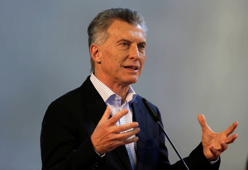 Argentina's Macri says inflation rising, central bank props up peso
