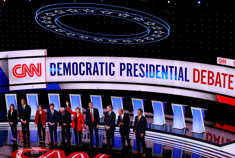 © Reuters. FILE PHOTO: The candidates stand on stage on the first night of the second 2020 Democratic U.S. presidential debate in Detroit