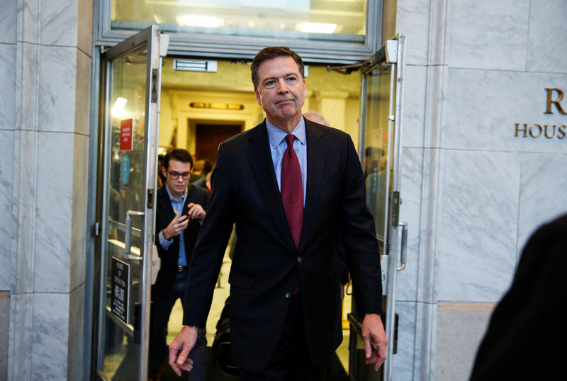 © Reuters. FILE PHOTO: Former FBI Director Comey departs after giving a private deposition to the House Judiciary and House Government and Oversight committees on Capitol Hill in Washington