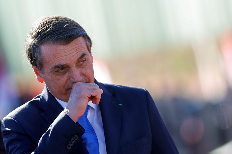 © Reuters. Brazil's President Jair Bolsonaro looks on after meeting with Chile's President Sebastian Pinera at the Alvorada Palace in Brasilia