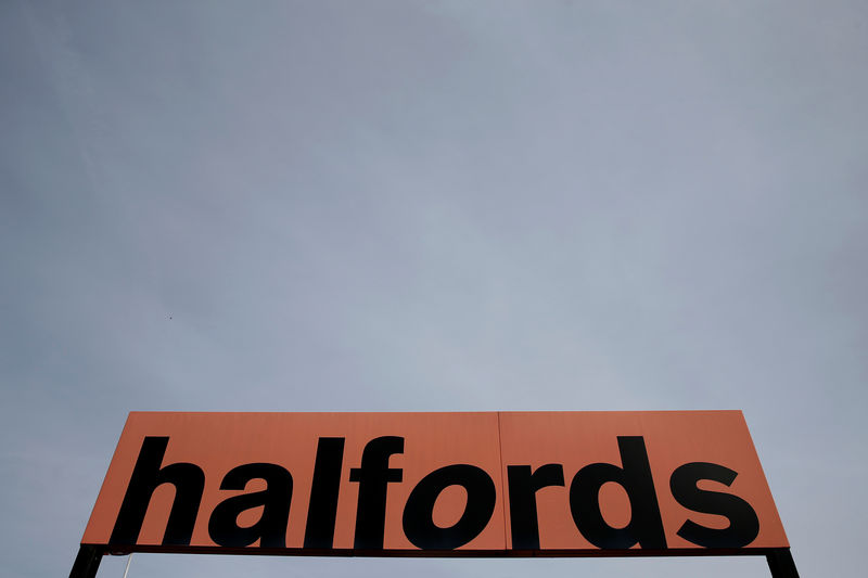 © Reuters. FILE PHOTO: A Halfords sign is seen outside a store in London