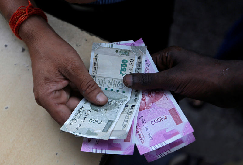 Indian rupee unlikely to gain traction as investors stay shy: Reuters poll