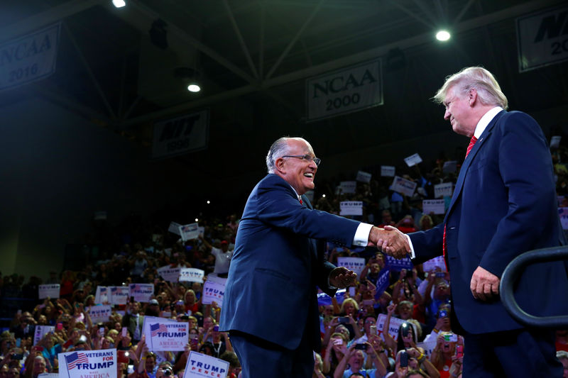 © Reuters. FILE PHOTO - Former New York mayor Rudy Giuliani greets Republican U.S. presidential nominee Donald Trump at the Trask Coliseum at University of North Carolina in Wilmington, North Carolina