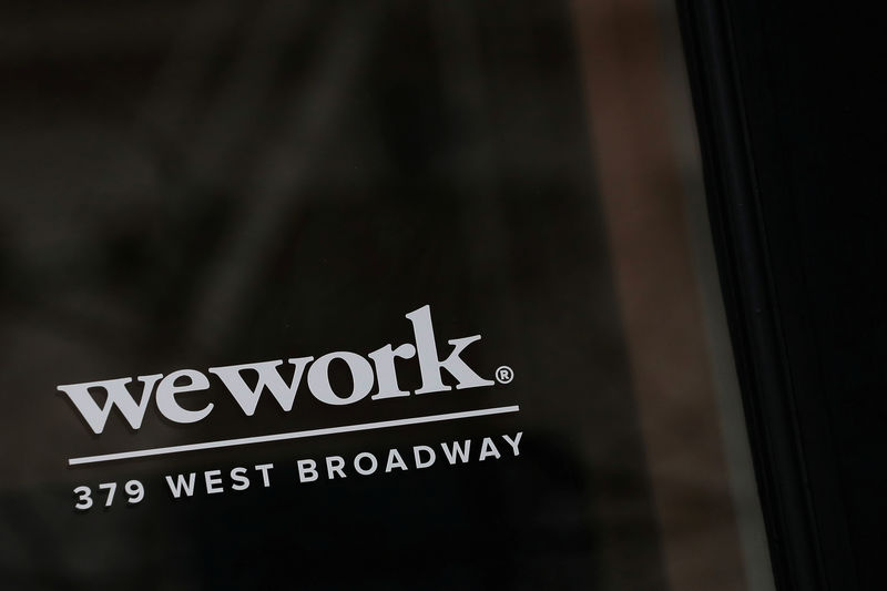 Softbank urges wework to shelve its ipo