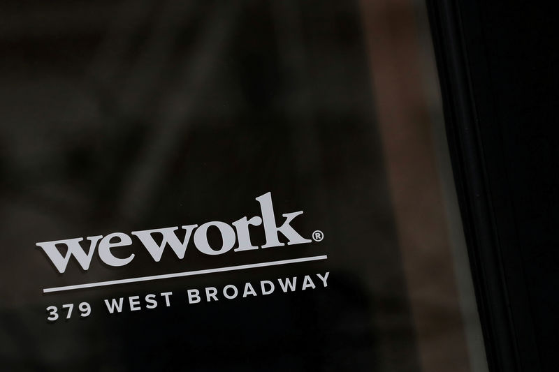 © Reuters. FILE PHOTO: The WeWork logo is displayed on the entrance of a co-working space in New York
