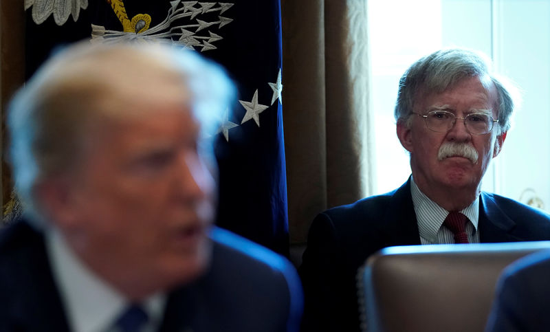 © Reuters. Bolton listens as Trump holds a cabinet meeting at the White House in Washington