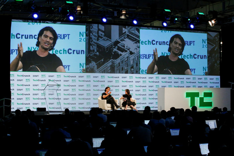 © Reuters. FILE PHOTO: Neumann, CEO of WeWork, speaks to guests during the TechCrunch Disrupt event in Manhattan