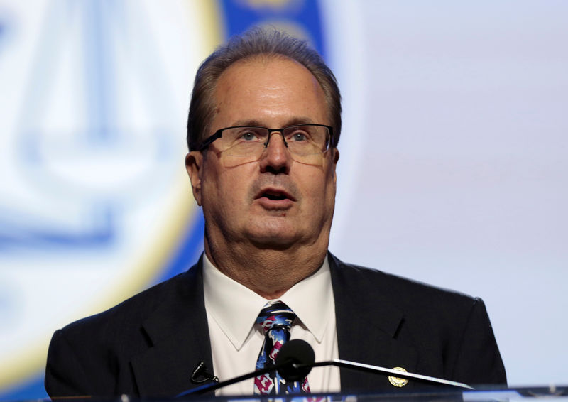 © Reuters. FILE PHOTO: United Auto Workers President Gary Jones delivers remarks at the opening plenary session of the National Association of the Advancement for Colored People's annual convention in Detroit