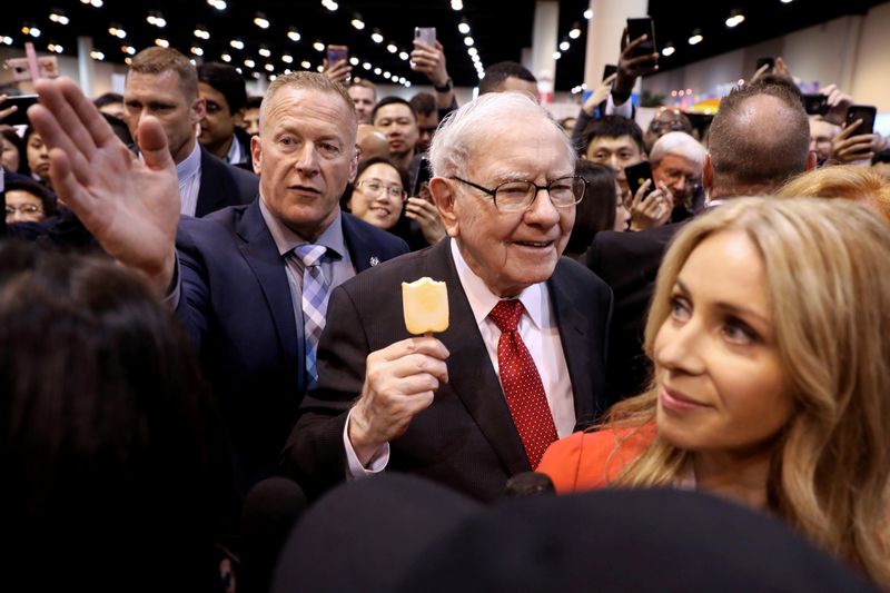 Buffett defends Berkshire stock push, reassures on future as profit smashes record